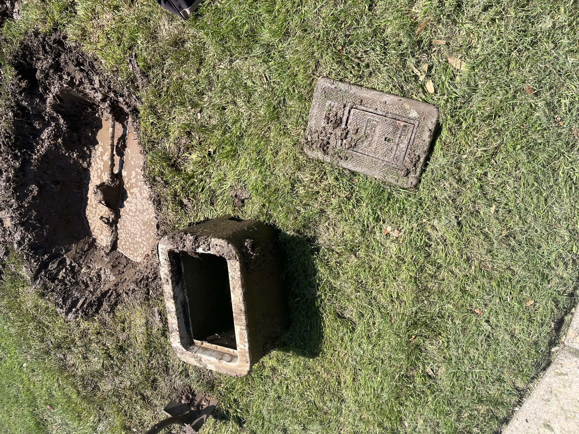 Open water meter box during leak diagnosis and service-line investigation