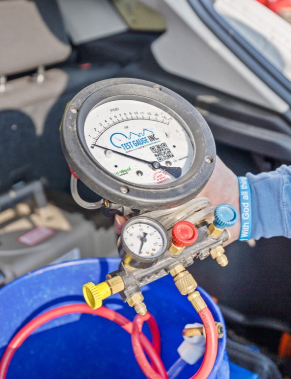 TCEQ-licensed tester performing a backflow preventer test for a Marble Falls, Texas property