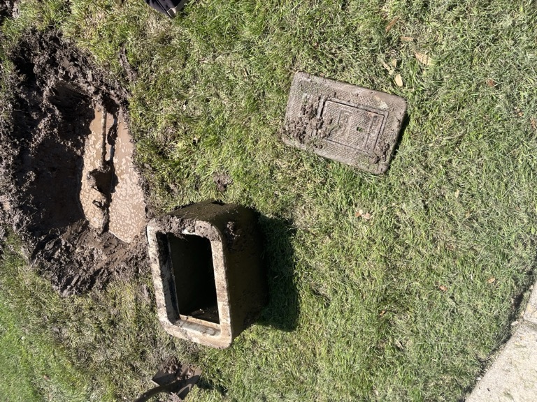 Excavated water meter box during leak detection in Austin TX