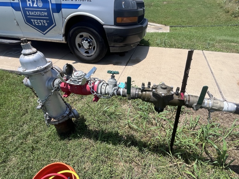 Private fire hydrant and backflow assembly serviced by H2O
