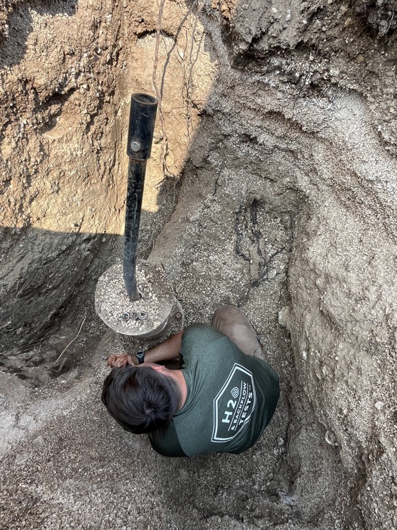 H2O technician preparing a below-grade private fire-water connection